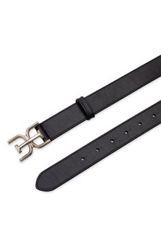 A logo-shaped buckle adds polish to this sleek leather belt that will complement your sophisticated style. 1 1/4" belt width Leather/polyurethane Imported Classic Black Belt With Metal Logo, Elegant Black Belt Buckles With Metal Logo, Business Leather Belt Buckles With Metal Logo, Leather Belt Buckles With Metal Logo For Business, Modern Business Belt Buckles With Metal Logo, Chic Formal Belts With Metal Logo, Leather Business Belt With Metal Logo, Sophisticated Style, Sam Edelman