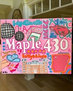 a person holding up a sign that says maple 480