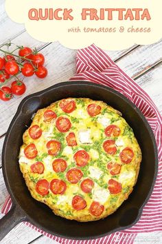 a quiche with tomatoes and cheese in a cast iron skillet on a wooden table