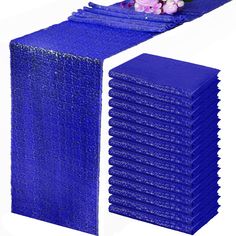 blue plastic table runners with flowers on each side and one in the middle, set against a white background