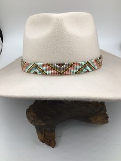 Leather Bead Hatband - Handcrafted by me in Wann, Oklahoma - Size 8/0 Beads are loomed (Chalk Green, Bronze, Mustard, Mauve, Turquoise Blue, and Terra Cotta) - Leather Ends are sewn and glued for added strength - Ties are 2mm Natural Leather - Width is 7/8" - Length is customized to your specification (Pictured is 23" Length) - Hats are for display purpose only.  NOTE:  Please state the length you need when placing your order!   If length not stated I will make the hatband to fit a 23" circumfer Handmade Southwestern Multicolor Hats, Handmade Multicolor Southwestern Hats, Handmade Southwestern Multicolor Hat Band, Adjustable White Southwestern Hat, Handmade Artisan Beige Hat Bands, White Southwestern Adjustable Hat, Southwestern White Adjustable Hat, Handmade Western Cream Hat Band, Artisan Beaded Hat Bands For Festivals