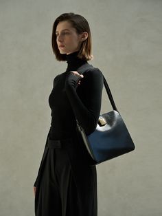 Editor's NotesAMAG STUDIO offers a collection that focuses on the essence of the clothing. It proposes simply beautiful outfits.- Structured square tote bag- Made of glossy and smooth leather- Square buckle embellished at the front- 3 compartments at the interior- Adjustable buckle shoulder strap- Feminine and classic moodMeasurements(in.)One Size- Size: 10.24 in. (W) * 9.45 in. (H) * 3.54 in. (D)Composition & Care- Material: 100% Cow Leather- Natural leather may have fine scratches and wrin Designer Square Box Bag, Elegant Square Shoulder Bag For Work, Timeless Black Square Shoulder Bag, Designer Square Shoulder Bag For Work, Classic Square Box Bag For Work, Sleek Square Formal Bags, Simply Beautiful, Natural Leather, Cow Leather