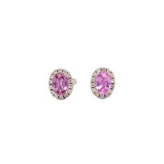 These stunning earrings feature two beautiful barbie pink sapphires, surrounded by a halo of natural earth mined diamonds, set in solid 14k white gold. These precious, elegant earrings make a perfect addition to your daily look, adding a unique and dazzling touch to any outfit. Get ready to shine with these delightful, sparkling earrings! Sapphire And Diamond Earrings, Sapphire Studs, Sparkle Earrings, Stunning Earrings, Elegant Earrings, Diamond Earrings Studs, Pink Sapphire, Halo Diamond, Gemstone Earrings