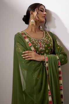 Green embroidered kurta in chanderi fabric with zardosi and pearl embroiderey. Comes with a matching net dupatta with zardosi work and matching pant. - Aza Fashions Green Chinon Kurta With Intricate Embroidery, Green Embroidered Chinon Fabric For Navratri, Green Chinon Embroidered Fabric For Navratri, Transitional Green Fabric With Resham Embroidery, Designer Mulmul Palazzo Set With Intricate Embroidery, Green Mulmul Palazzo Set With Zari Work, Green Mulmul Sharara With Zari Work, Green Palazzo Set With Zari Work, Embroidered Pista Green Palazzo Set For Diwali