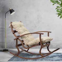 a rocking chair with a pillow on it