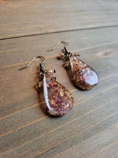 Beautiful real flower petal earrings in resin dangling teardrops made from young burgundy rose petals. Boldly colorful, naturally beautiful, and hand made from the first step. Hand picked flowers that are gently dried, and perfectly preserved in eternal elegance ♥ Be sure to check out the RED EARRINGS section at EarringsbyLCreations for all beautiful red colored earrings available! https://www.etsy.com/shop/EarringsByLCreations?section_id=28420977 Made with quality materials and always nickel an Resin Teardrop Earrings For Gifts, Dangle Resin Flower Earrings, Resin Drop Earrings With Flower Charm, Resin Flower Charm Drop Earrings, Dangle Earrings With Flower Charm In Resin, Diy Resin Projects, Burlap Ribbon, Red Earrings, Colorful Jewelry