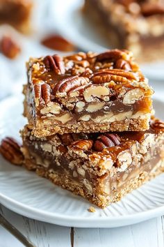 three pieces of pecan bar stacked on top of each other