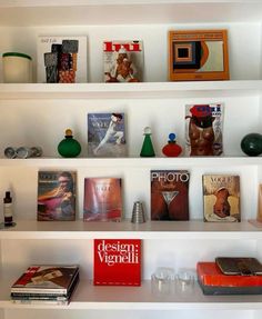 several books and magazines are on the shelves