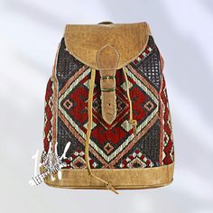 Moroccan leather backpack with Berber Kilim Moroccan leather backpack, bohemian backpack, unisex leather purse, leather brown rucksack. A useful, natural article that creates pleasure Features two pockets on the side and one on the front all with closure. Also adjustable shoulder straps on the back. Carpet design may vary from one to another. Made of genuine leather in a small shop, made with love and creativity. Dimensions: 36 x 13 cm (H * L) Leather type: Goat Color:  Tan Large main compartmen Bohemian Handmade Backpack For Travel, Bohemian Handmade Travel Backpack, Bohemian Brown Backpack, Bohemian Brown Standard Backpack, Bohemian Style Brown Backpack, Artisan Brown Backpack Shoulder Bag, Artisan Brown Backpack For Travel, Handmade Bohemian Standard Backpack, Bohemian Brown Backpack Shoulder Bag