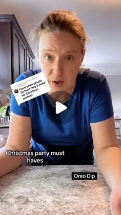 a woman sitting at a kitchen counter with an ad on her face and the caption says, christmas party must haves oreo dip