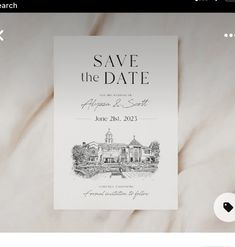 an image of a save the date card on a bed with white sheets and pillows