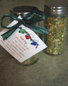 a jar filled with green stuff next to a tag