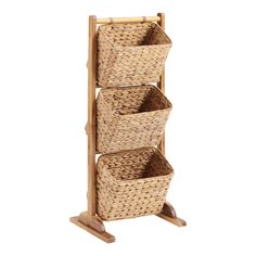 three wicker baskets on a wooden stand