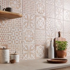 a kitchen counter with pots and plates on it