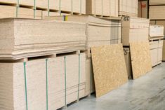 stacks of plywood boards in a warehouse