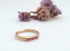 A beautiful 14k solid yellow, white or rose gold signet ring for women with 5 red rubies, great also as a unique ruby wedding ring.A dainty 14K yellow solid gold signet ring with 5 rubies. At the front of the ring, there are delicate circular engravings that ad grace to this very feminine ring. This beautiful ring is light and comfortable to wear and will be great for everyday use, as for special occasions. You can wear it on its own as a singular ring but it will also look extra-chic stacked wi Rose Gold Stackable Ruby Ring As A Gift, Rose Gold Open Ruby Ring For Promise, Minimalist Rose Gold Ruby Ring For Gift, Minimalist Rose Gold Ruby Ring As Gift, Stackable Rose Gold Ruby Ring For Anniversary, Rose Gold Stackable Ruby Ring For Anniversary, Anniversary Rose Gold Stackable Ruby Ring, Minimalist Rose Gold Ruby Ring For Anniversary, Elegant Pink Gold Ruby Promise Ring