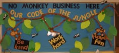 a bulletin board with monkeys on it and words that read, no monkey business here our code of the jungle