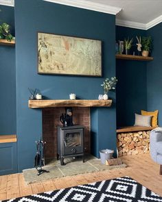 a living room with blue walls and a wood burning stove