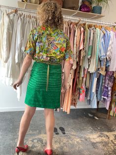 Dosa Green Silk Wrap Skirt. A fun and bright knee-length skirt in a grass green textured silk. Gives a modern-luau vibe! Interior is lined in a gorgeous patchwork stitched pattern, so the skirt could potentially be worn reversible as well! Wrap ties at the waist, allowing for an adjustable fit. Marked one size, but best fits a size M/L. 100% silk, dry clean only. Made in the USA. In excellent, like-new condition. Approx. Measurements: Adjustable waist: 15" through 18" laid flat across Length: 21 Spring Green Relaxed Skirt, Green Relaxed Skirt For Spring, Green Full Skirt For Spring, Green Silk Bottoms For Summer, Green Lined Skirt For Spring, Green Fitted Silk Bottoms, Spring Green Gathered Skirt, Fitted Silk Green Bottoms, Fitted Green Silk Bottoms