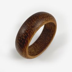 a wooden ring is shown against a white background