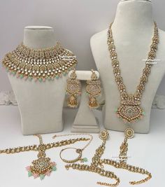 several necklaces and bracelets are displayed on mannequins