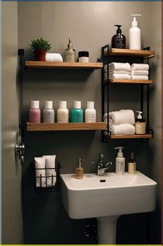 a bathroom with shelving above the sink and soaps on the shelves next to it