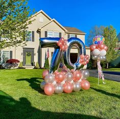 an inflatable balloon number sits on the lawn