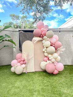 balloons and streamers are arranged on the lawn