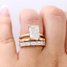 This timeless, sleek wedding band shows off five baguettes, held by heart-shaped prongs. She is pictured stacked with the Celeste ring and the Horizon wedding band, as well as the Serena ring and the Lauryn wedding band. Details: 14k white, yellow, or rose gold or platinum 1.75ct total carat weight— lab-grown diamonds or created emeralds *All diamonds are DEF color, VS1 clarity or better *Please note that colored gemstones may vary slightly in color. We do our best to accurately portray the colo Rose Gold Emerald Cut Engagement Ring, Mixed Metal Wedding Rings, Emerald Cut Wedding Band, Unique Wedding Bands For Women, Sleek Wedding, Baguette Diamond Wedding Band, Fair Wedding, Baguette Wedding Band, Emerald Wedding Band