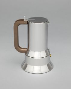 a stainless steel coffee pot with a wooden handle and an open lid, on a gray background