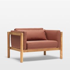 a brown couch sitting on top of a wooden frame