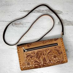 With its luxurious hand-embossed leather and stitched border detail, the Itzel Natural Leather Crossbody Bag by Que Chula is the perfect way to add a touch of bold style to any outfit. Securely store your essentials with the convenient credit card slots and exterior pocket, then let this daring design take you from day to night. Wow! Hand embossed genuine full grain leather Removable shoulder strap 8 Credit card slots 1 interior slip pocket 1 exterior zip pocket 9.5” x 5” x 2”