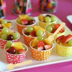 small cups filled with fruit sitting on top of a white plate