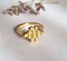 Bunch of grapes ring, gold plated ring, handmade ring, designer ring, vintage ring, dainty ring, delicate gold ring, gift ring for girls A delicate band decorated with a handmade bunch of grapes top, which was designed in a vintage style. Dimensions: The top size is 1.25x1 cm (0.5x0.4 inches) It is available in multiple sizes. Please choose at checkout. This delicate gold ring is available both in 14k gold plating and sterling silver and a beautiful gift ring for girls and bridesmaid. It can als Dainty Brass Rings For Wedding, Dainty Brass Wedding Rings, Handmade Yellow Gold Stackable Rings, Handmade Gold Plated Rings For Promise, Unique Brass Stackable Rings As Gift, Handmade Yellow Gold Stackable Rings For Promise, Handmade Yellow Gold Stackable Wedding Rings, Handmade Yellow Gold Stackable Promise Rings, Handmade Yellow Gold Stackable Open Rings