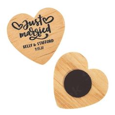 two wooden heart magnets with the words just married on them