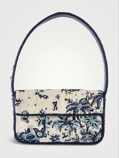 The Tommy is a hand-beaded shoulder bag with vegan leather piping. This style features a single flap closure, inner zip pouch and a magnetic pocket on the back. Beaded; Trim: Vegan Leather Magnetic snap closure Imported Size Width: 9.6" Height: 14.5'' Depth: 2'' Handle Drop: 8.8" Beaded Shoulder Bag, Girly Bags, Fancy Bags, Crochet Design, Crocodiles, Pretty Bags, Cute Purses, Northern Italy, Looks Chic