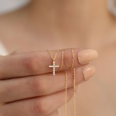 Discover the timeless elegance and spiritual significance of our 14K Solid Gold Diamond Cross Necklace. Meticulously handcrafted from the finest 14K solid gold, this necklace features a beautifully designed cross pendant, adorned with brilliant-cut diamonds that capture the light with every turn.  This necklace is perfect for various occasions, whether as a meaningful gift for religious celebrations like baptisms and confirmations or as a cherished everyday accessory. It serves not only as a piece of fine jewelry but also as a profound expression of personal beliefs and spirituality. The gold and diamonds are sourced responsibly, ensuring that each piece is not only stunning but also ethically produced. To maintain the necklace's pristine condition, store it in a dry, soft cloth bag away f Personal Beliefs, Diamond Cross Necklace Gold, Diamond Cross Necklace, Diamond Cross, Everyday Accessories, Religious Jewelry, Lovely Jewellery, Real Diamonds, Mother Day Gifts