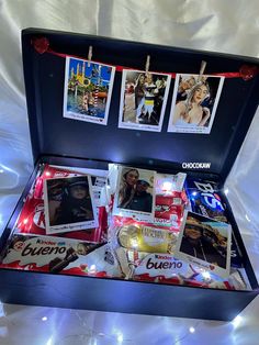 an open box with pictures and lights on it