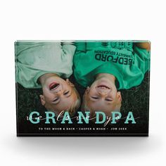 the cd cover for grandpaa to the moon and back, featuring two children laying on their heads