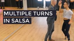 two people dancing in an empty room with the words multiple turns in salsa