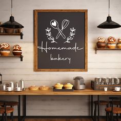 a chalkboard with the words homemade bakery on it in front of some cupcakes