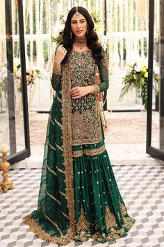 a beautiful woman in a green lehenga