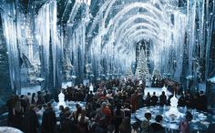 a large group of people standing in front of a christmas tree