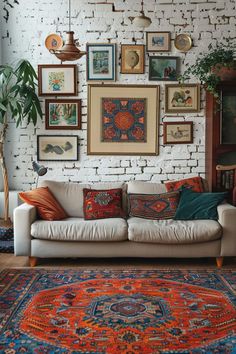 a living room filled with furniture and lots of framed pictures on the wall above it