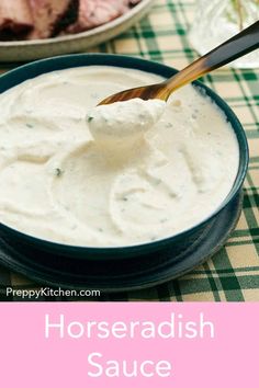 horseradish sauce in a blue bowl with a wooden spoon on the side and green checkered tablecloth