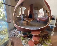 an unusual house made out of wood and clay