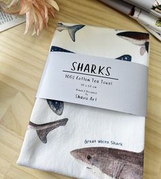 two napkins with sharks printed on them