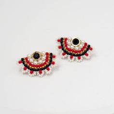 "I created these red & black Stud earrings by hand, using Swarovski pearls 3mm, Miyuki round seed beads, and 14k goldfilled push back Closure * If you chose the sterling silver option, all the metal pieces and beads will be replaced with silver metal and silver colored beads * Measurements: Earring length: 0.59\" (1.5cm) Earrings width: 1.06\" (2.7cm) * The earrings will come beautifully packaged for a gift. * For other stud earrings: https://www.etsy.com/il-en/shop/LioraBJewelry?ref=seller- Elegant Black Earrings With Tiny Beads, Traditional Black Jewelry With Bead Caps, Handmade Red Pearl Earrings For Party, Black Earrings With Tiny Round Beads, Elegant Red Earrings With Tiny Beads, Elegant Red Earrings With Black Beads, Handmade Red Pearl Earrings, Handmade Red Round Pearl Earrings, Black Earrings With Colorful Beads