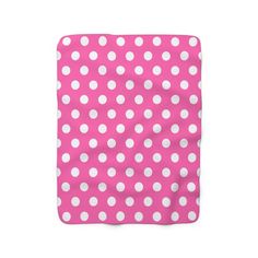 a pink and white polka dot blanket