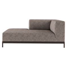 a gray couch sitting on top of a white floor